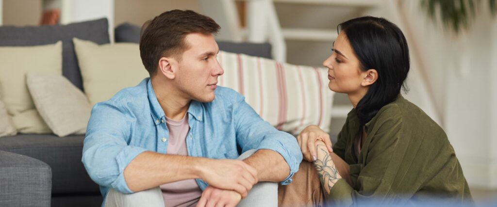 Couple talking on the couch