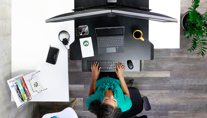 bird's eye view of woman sitting at her Workfit workstation